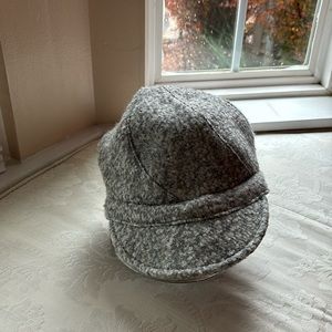 Grey Boucle cap. Polyester/Wool blend